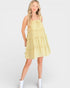 Woman wearing a yellow dress with a white background