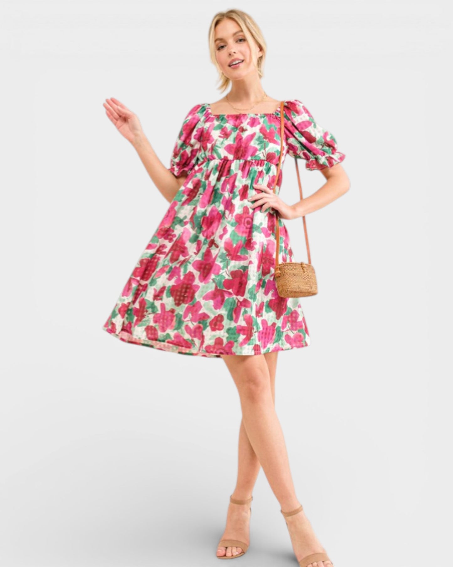 Woman wearing a floral dress on a white background