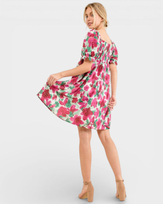 Woman wearing a floral dress on a white background