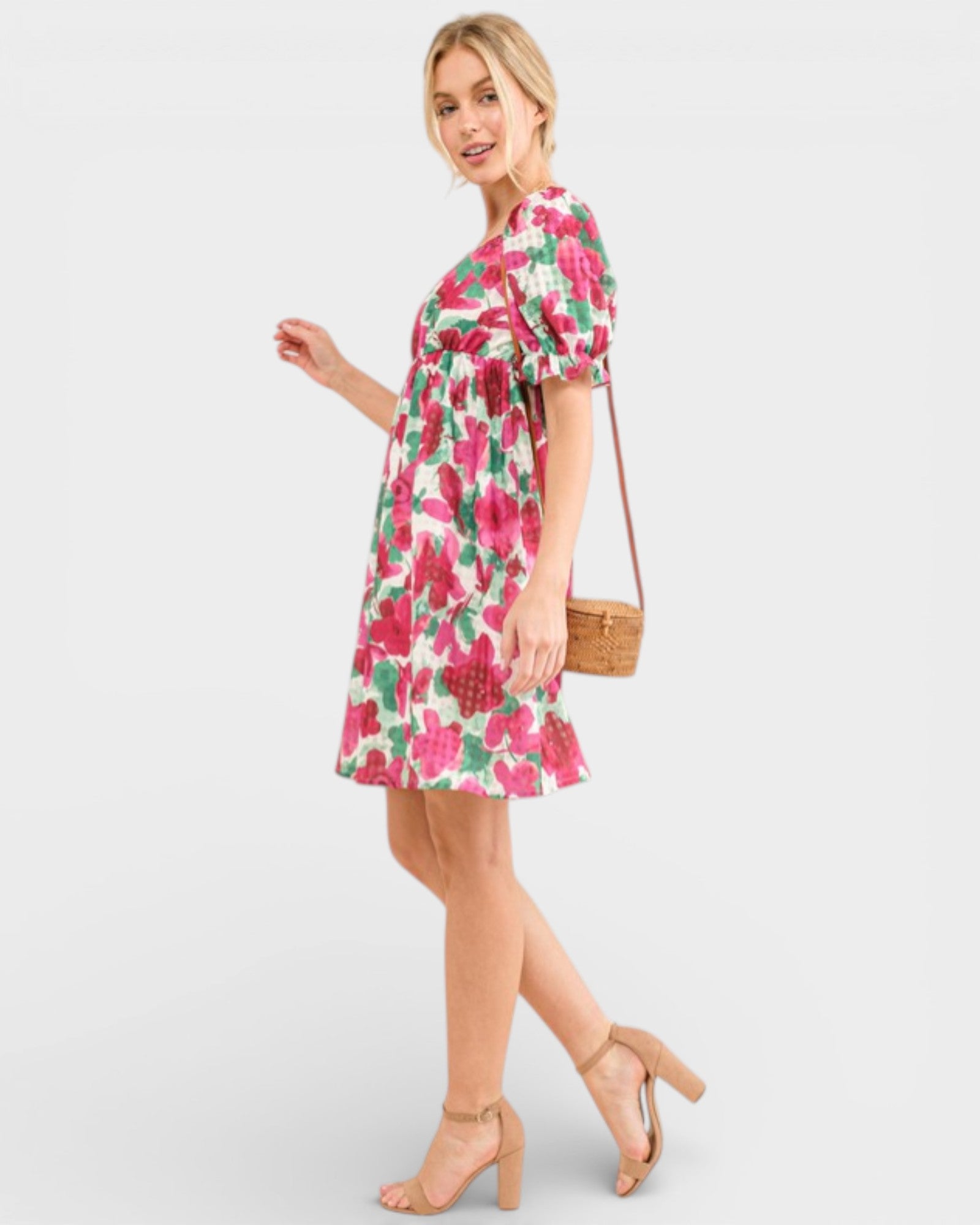 Woman wearing a floral dress with a white background