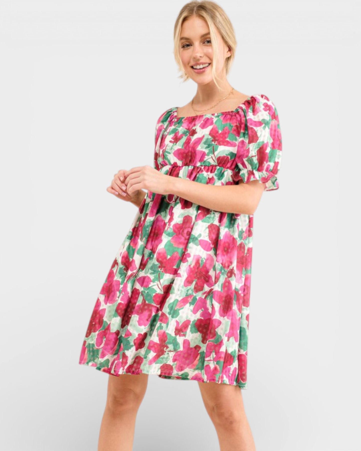 Woman wearing a floral dress on a white background