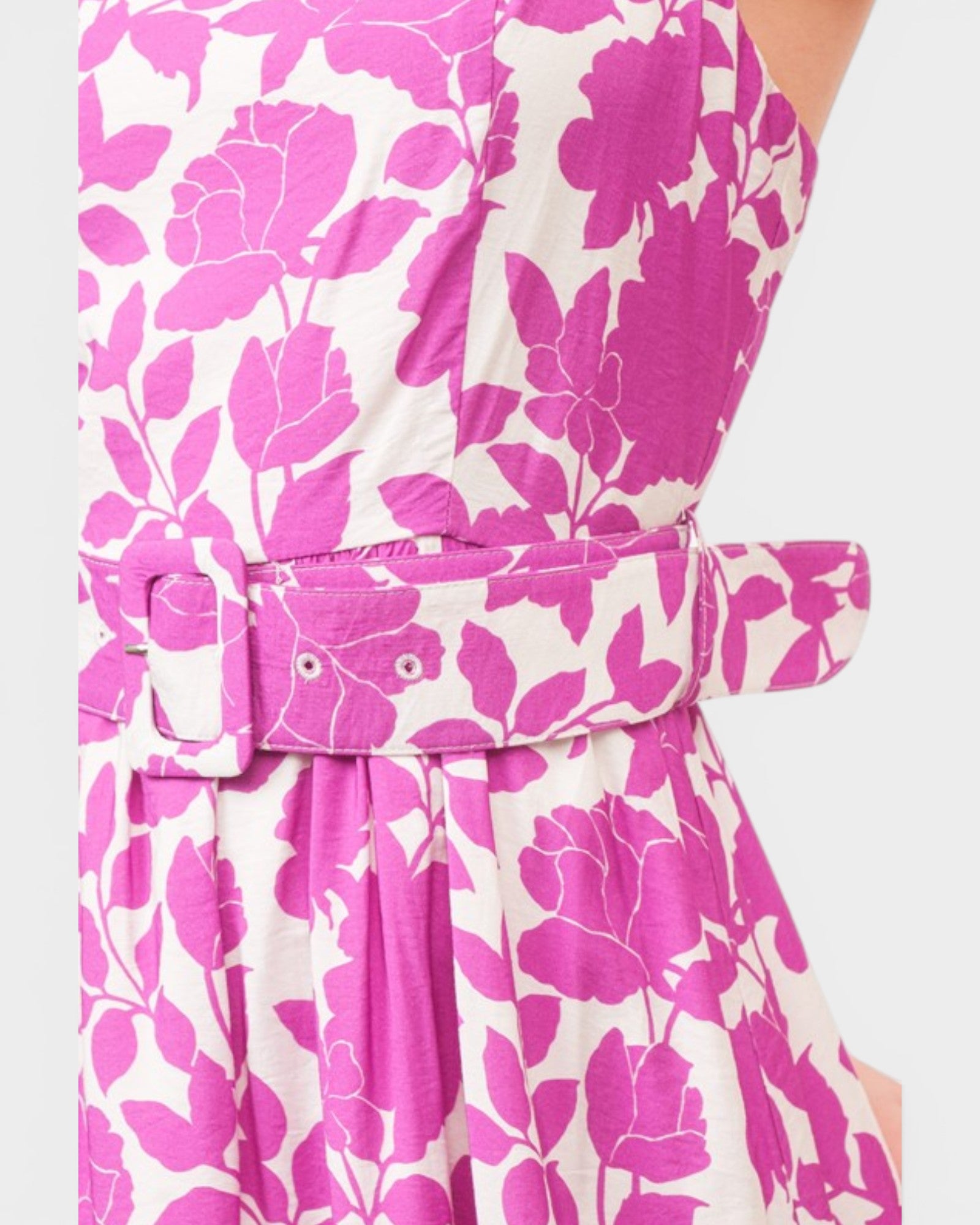 Pink floral dress with a belt on a white background