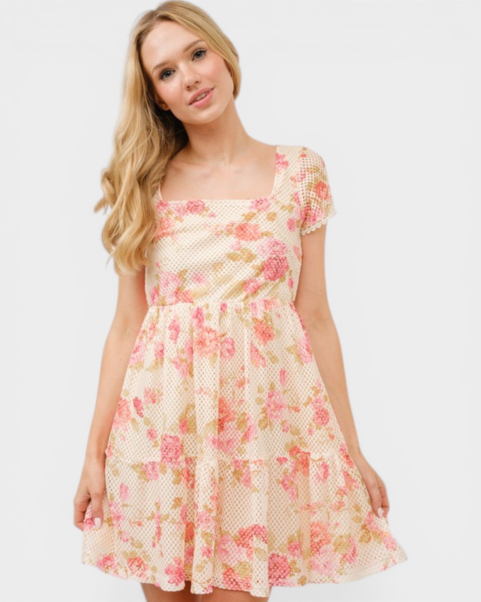 Woman wearing a floral dress on a white background