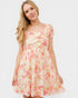 Woman wearing a floral dress on a white background