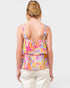 Woman wearing a colorful tank top with a white background