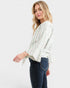 Woman wearing a striped blouse and jeans on a white background