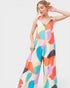 Woman wearing a colorful patterned dress on a white background