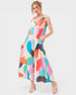 Woman wearing a colorful patterned dress on a white background
