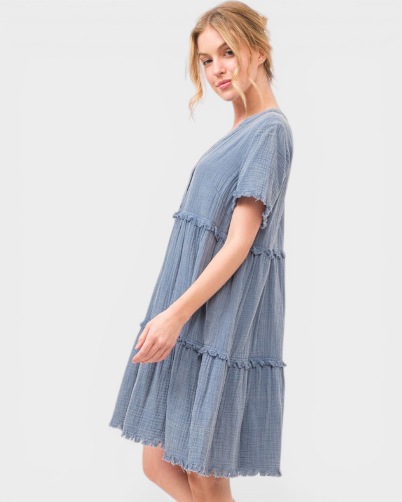 Woman wearing a blue dress on a white background