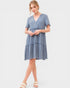 Woman wearing a blue dress on a white background