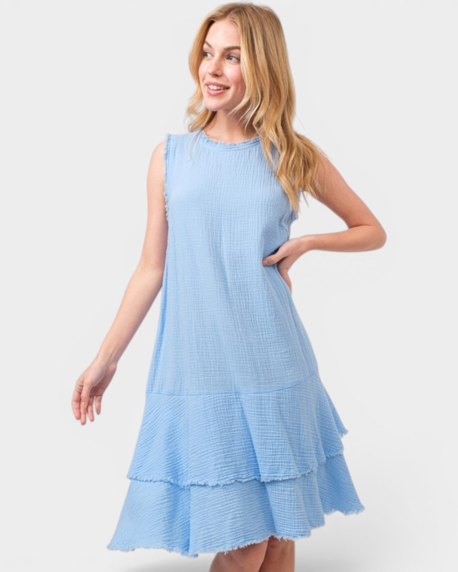 Woman wearing a light blue dress on a white background