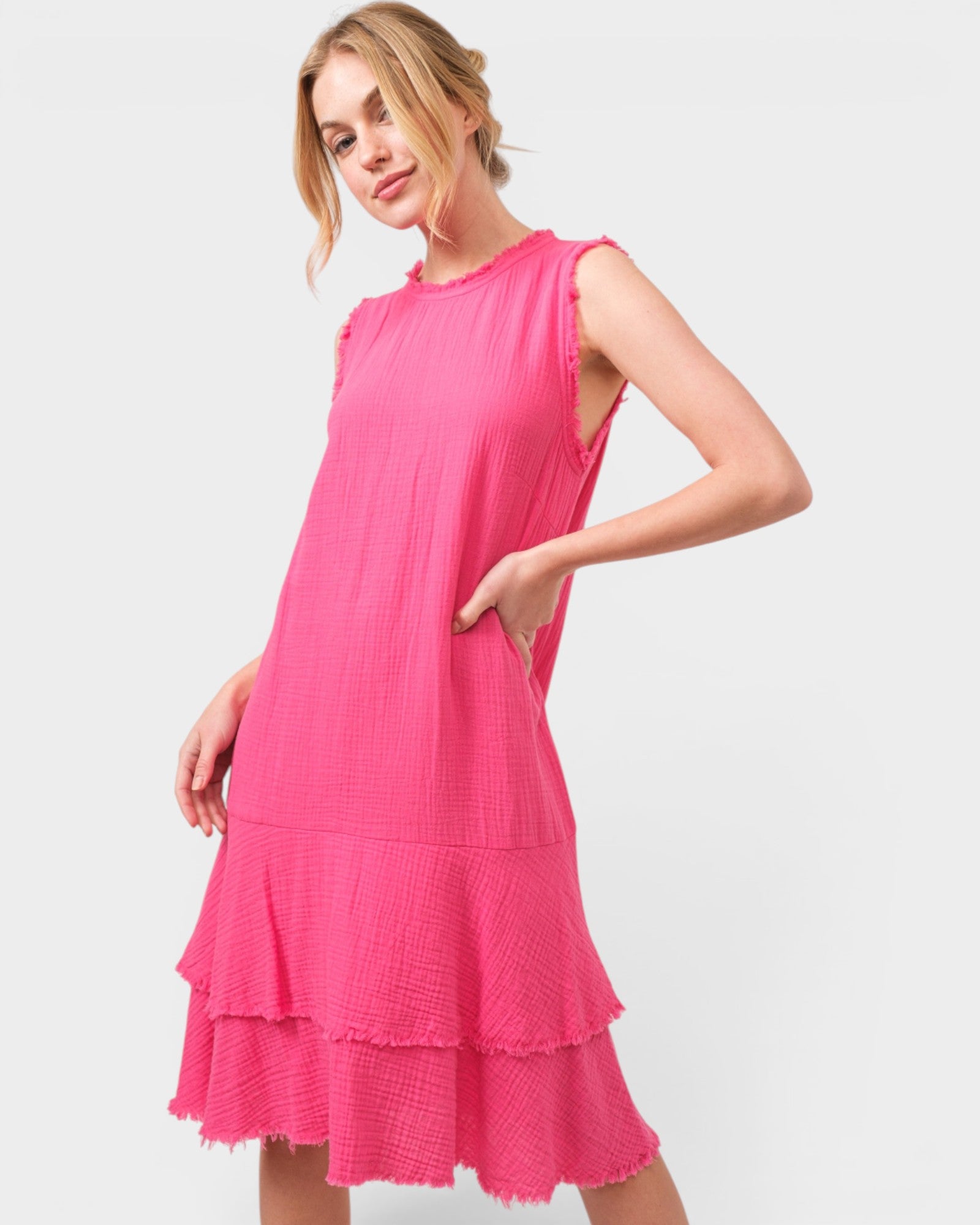 Woman wearing a pink dress on a white background
