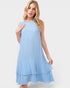 Woman wearing a light blue dress on a white background