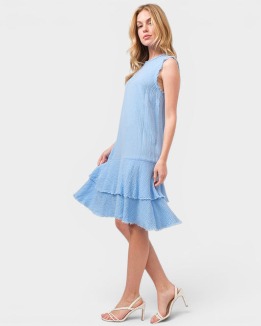Woman wearing a light blue dress on a white background
