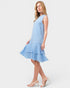 Woman wearing a light blue dress on a white background