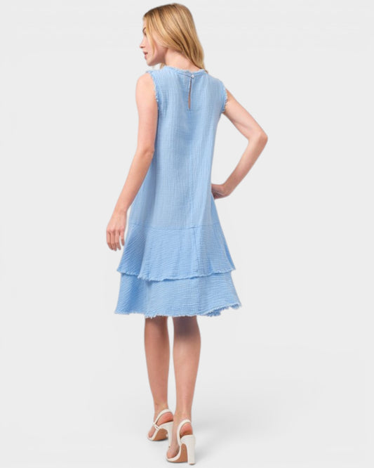 Woman wearing a light blue dress on a white background