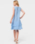 Woman wearing a light blue dress on a white background
