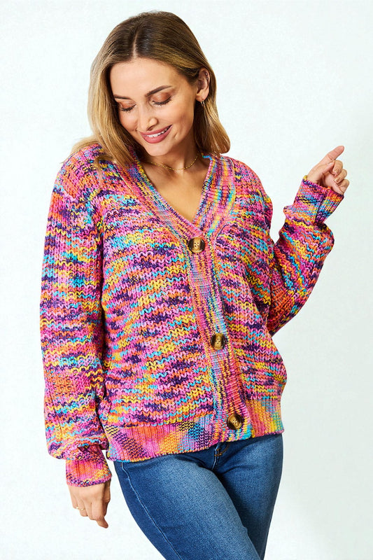 Woman wearing a colorful knitted cardigan on a white background