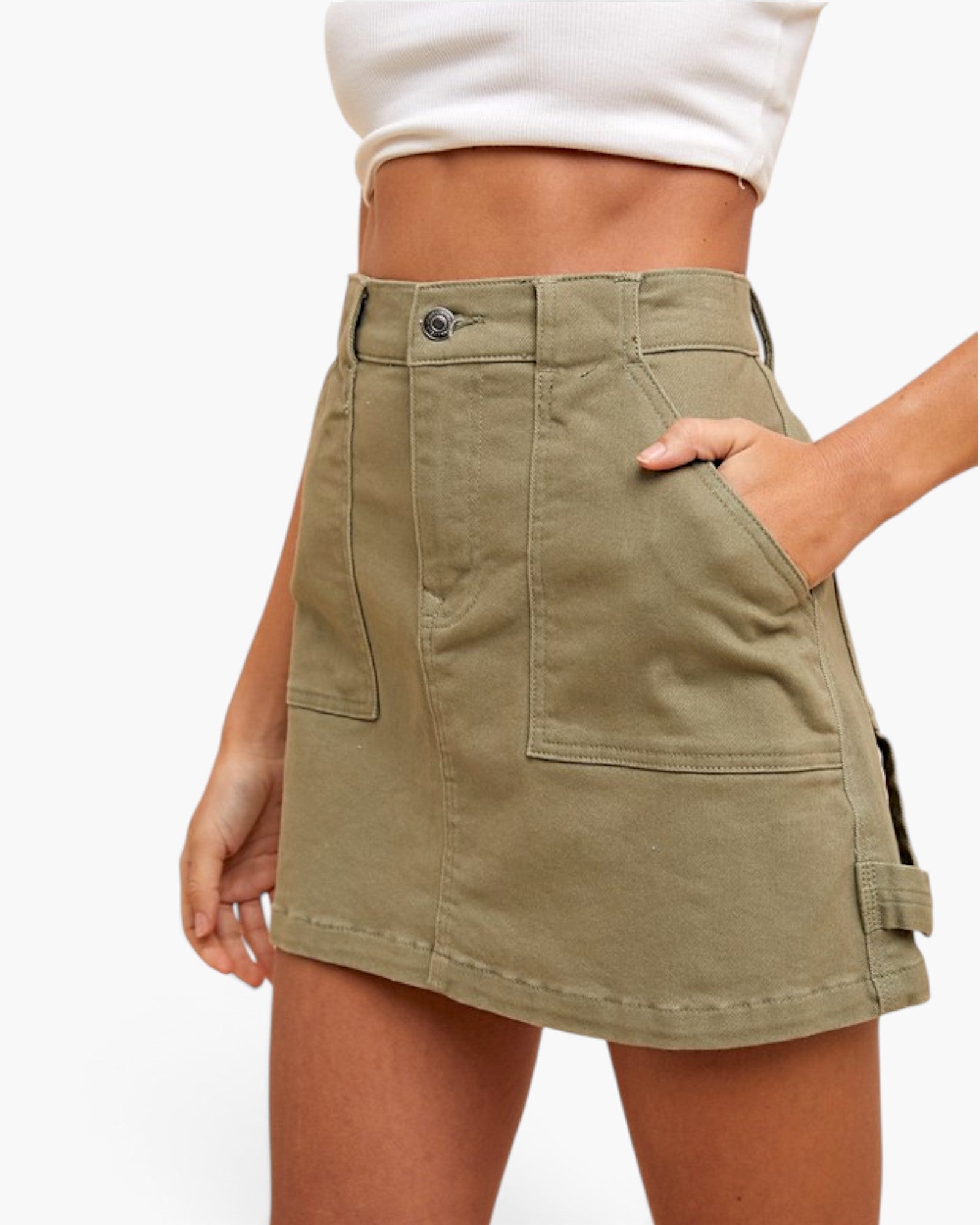 An olive green cargo-style mini skirt with front patch pockets and side cargo pockets, shown on a model against a plain white background.