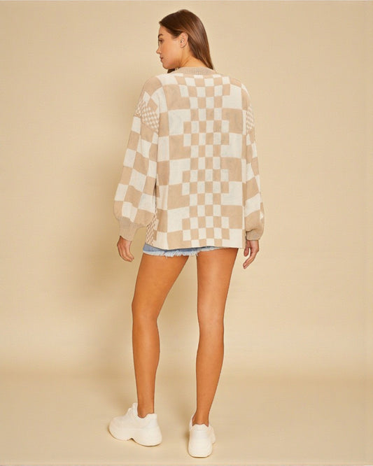 Person wearing a checkered sweater and shorts on a beige background