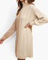 A woman wearing a chunky knit turtleneck sweater dress in cream with a textured cable pattern, shown from the side against a plain white background.