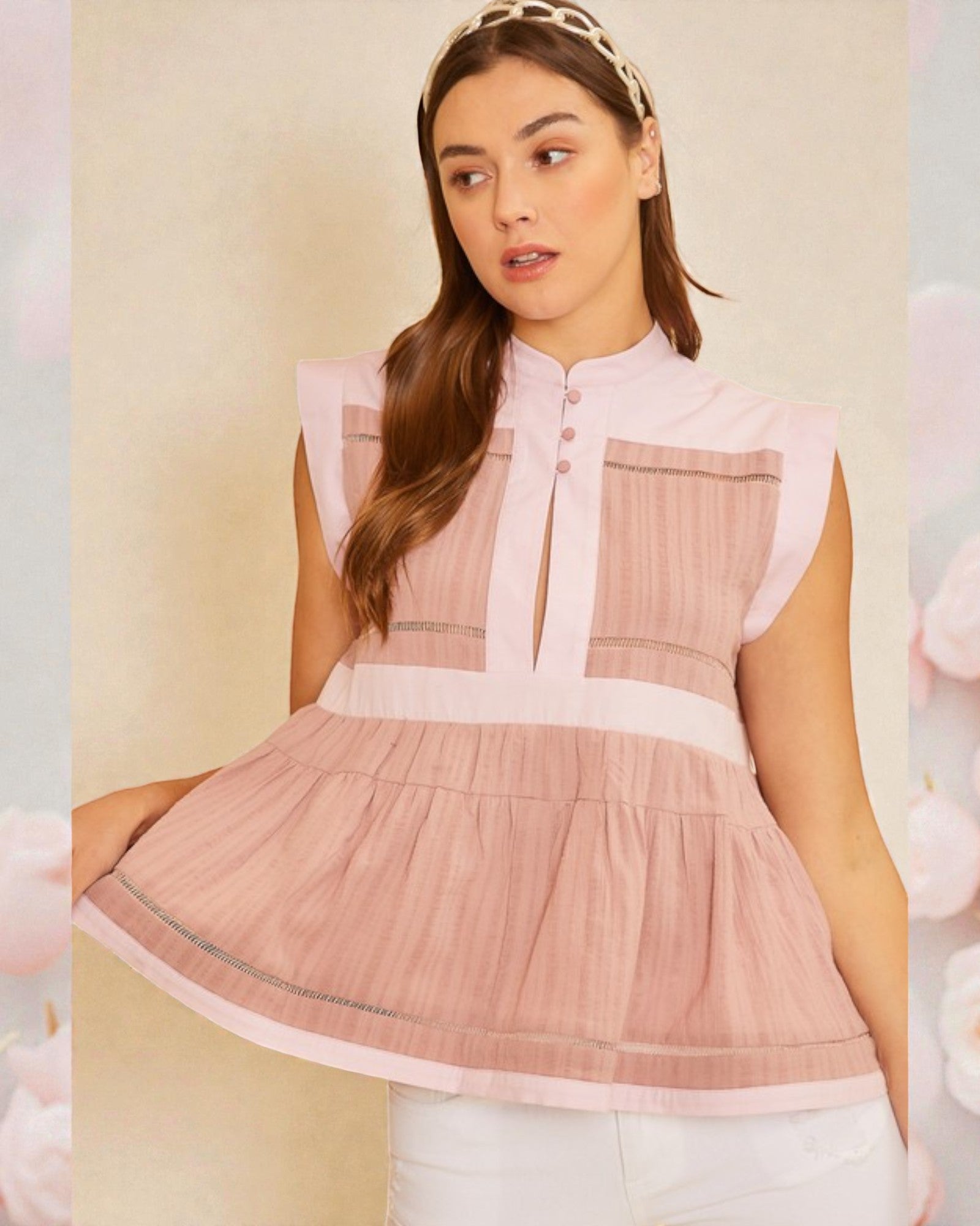 Woman wearing a pink blouse with a blurred background