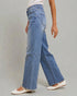 Person wearing blue wide-leg jeans on a gray background