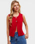 Woman wearing a red sleeveless top with buttons and blue jeans on a white background