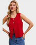Woman wearing a red sleeveless top with a white background