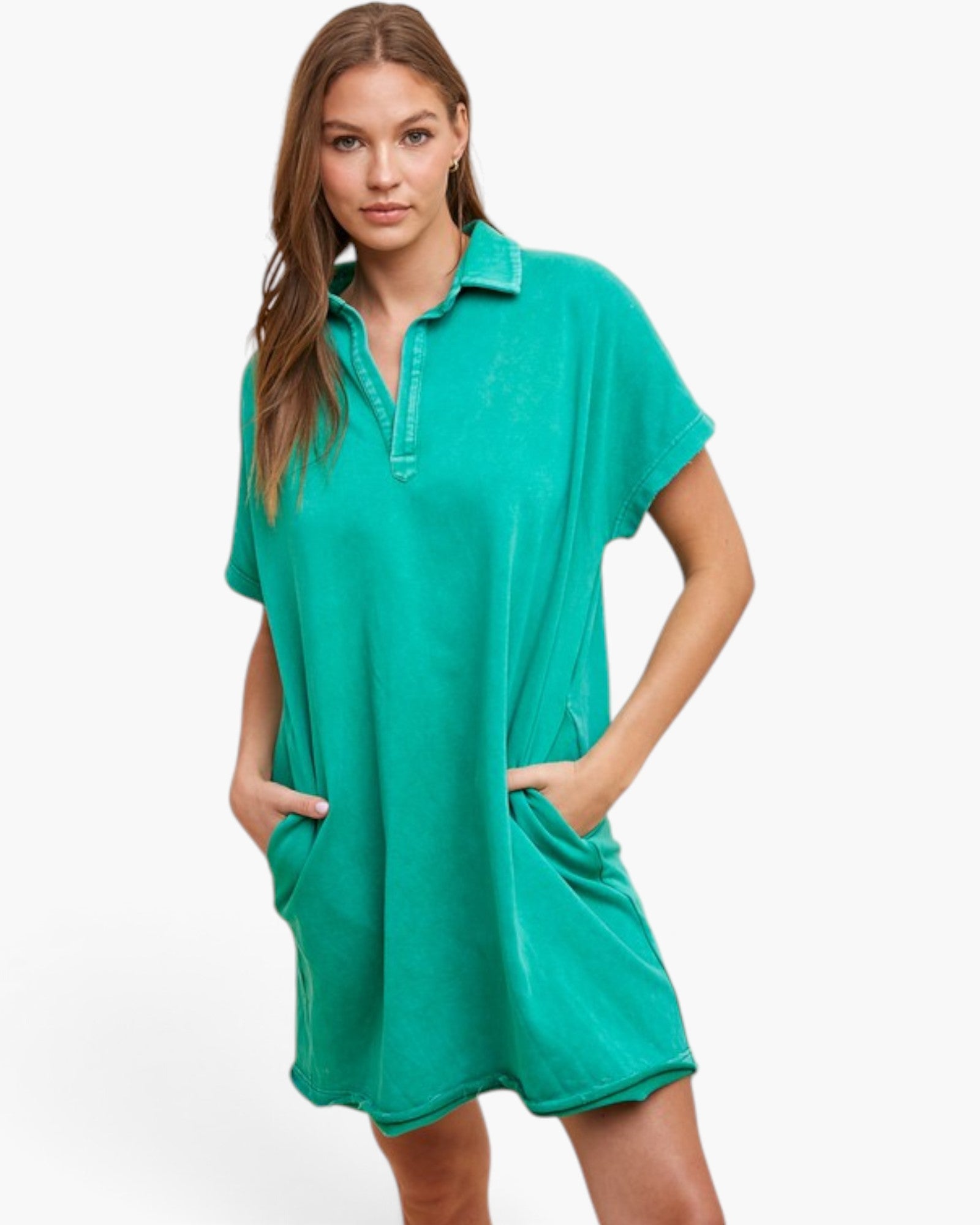 A woman modeling a short-sleeve, collared, polo-style nightshirt in a vibrant teal green color, set against a plain white studio background.