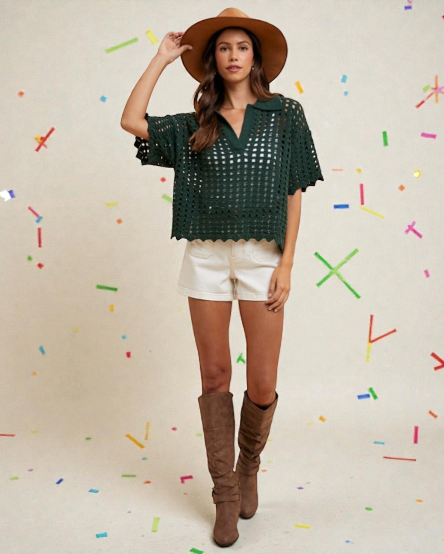 Woman wearing a green crochet top, white shorts, and brown boots against a colorful confetti background.