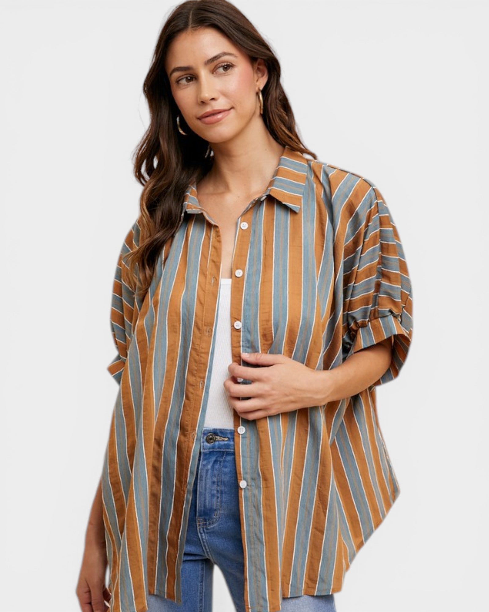 Woman wearing a striped shirt with a plain background