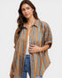 Woman wearing a striped shirt with a plain background