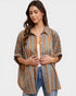 Woman wearing a striped shirt with a plain background