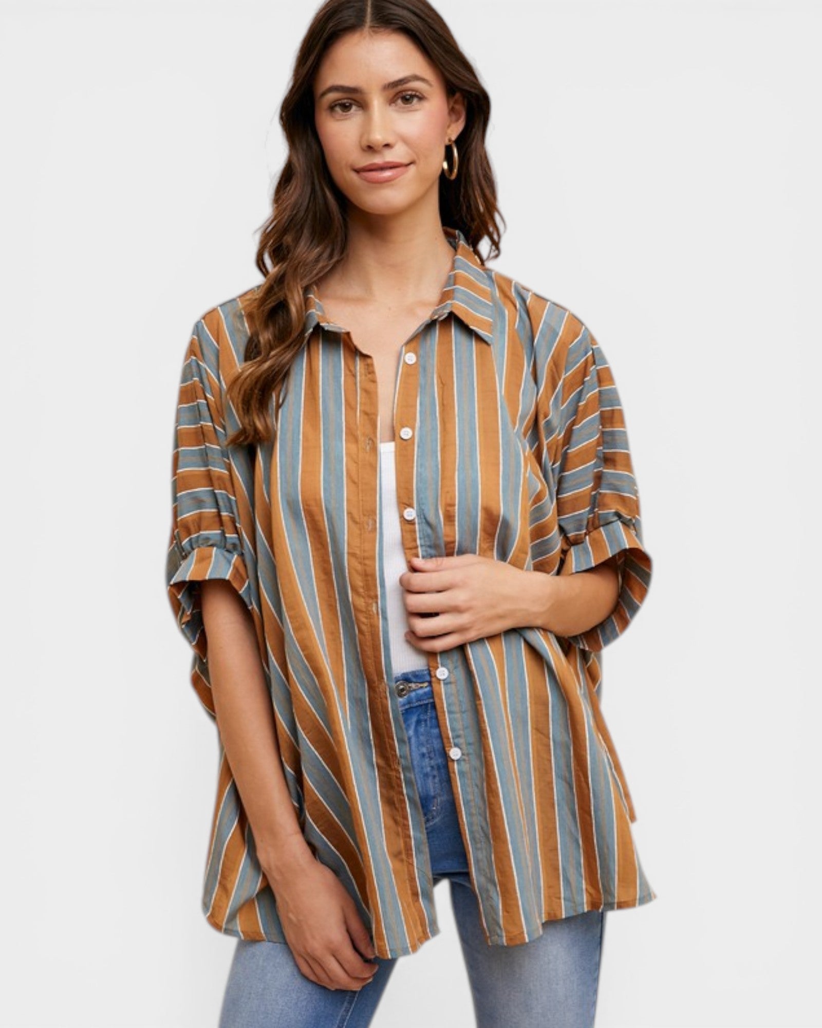Woman wearing a striped shirt with a plain background