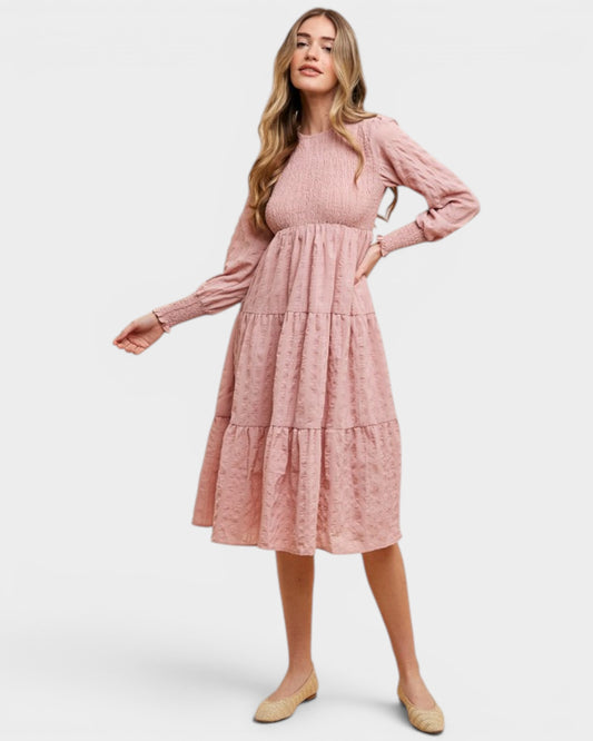 Woman wearing a pink dress on a white background