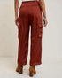 Brown cargo pants worn by a person on a white background