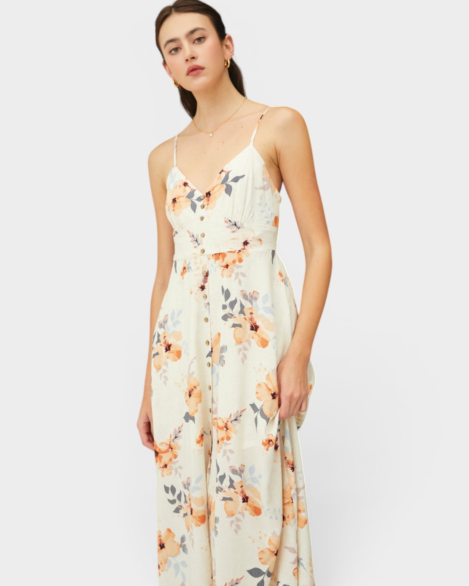 Woman wearing a floral dress on a white background