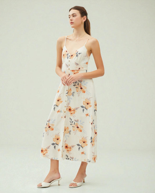 Woman wearing a floral dress on a plain background