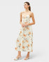 Woman wearing a floral dress on a white background