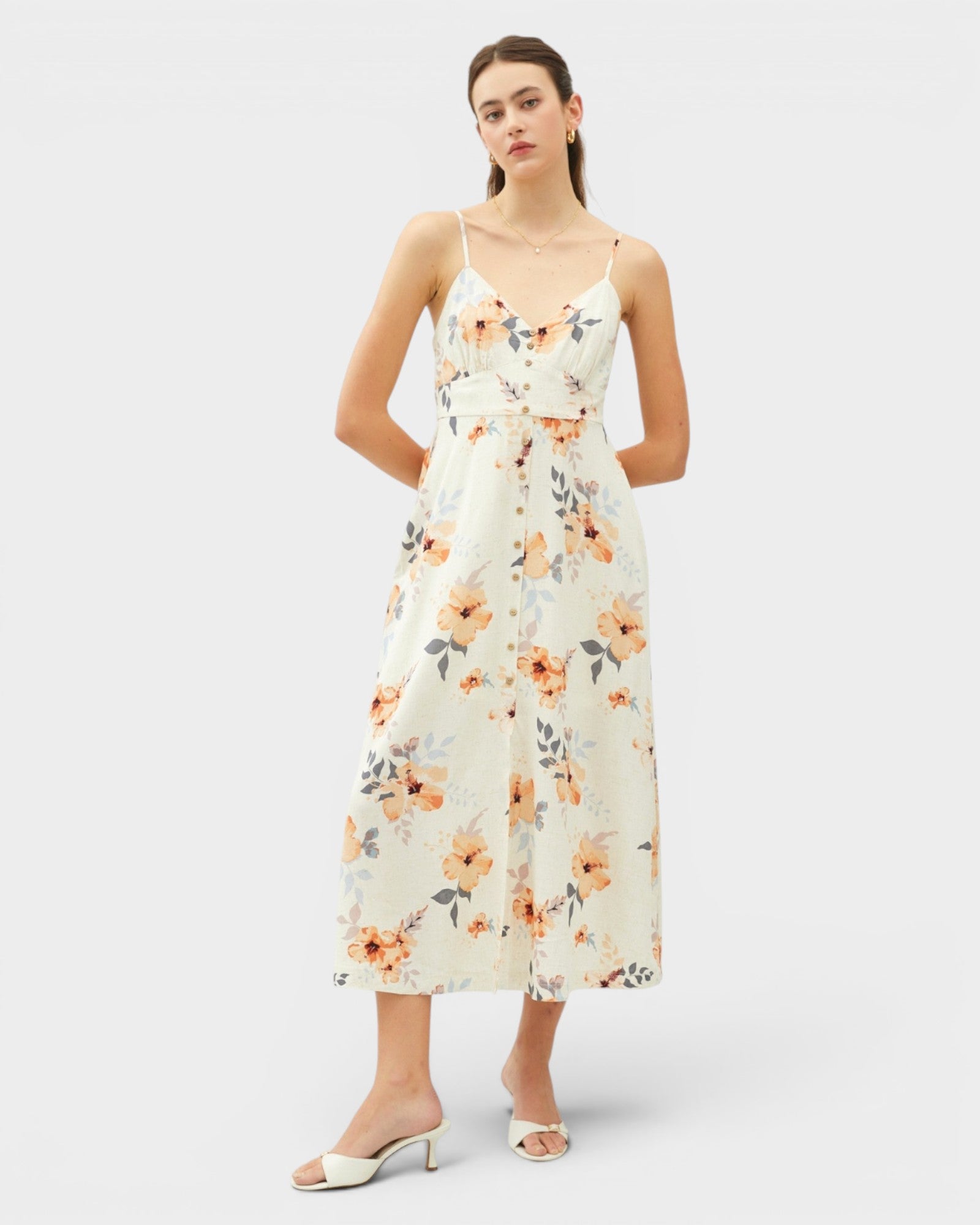 Woman wearing a floral dress on a white background