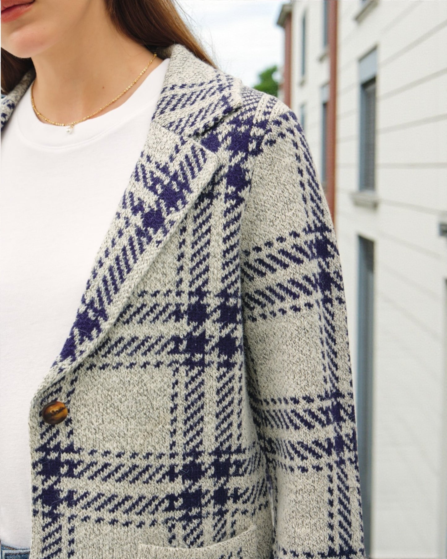 Plaid patterned coat with a blurred background