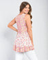 Woman wearing a floral dress on a white background