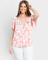Blusa con hombros descubiertos y estampado floral en color rosa