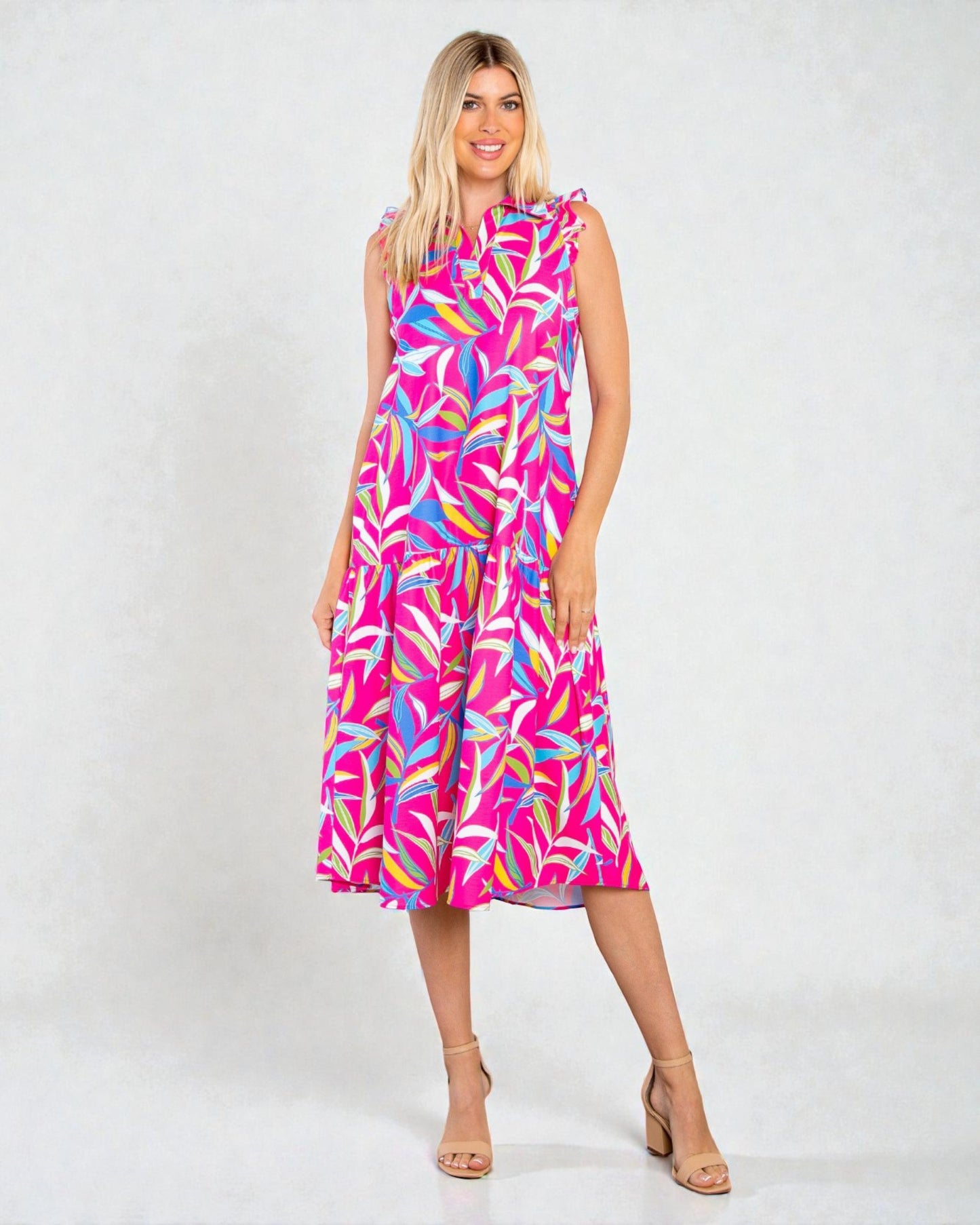 Woman wearing a colorful dress with a white background