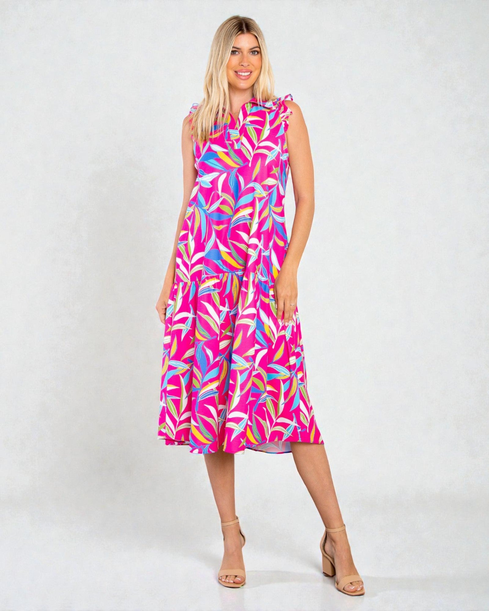 Woman wearing a colorful dress with a white background