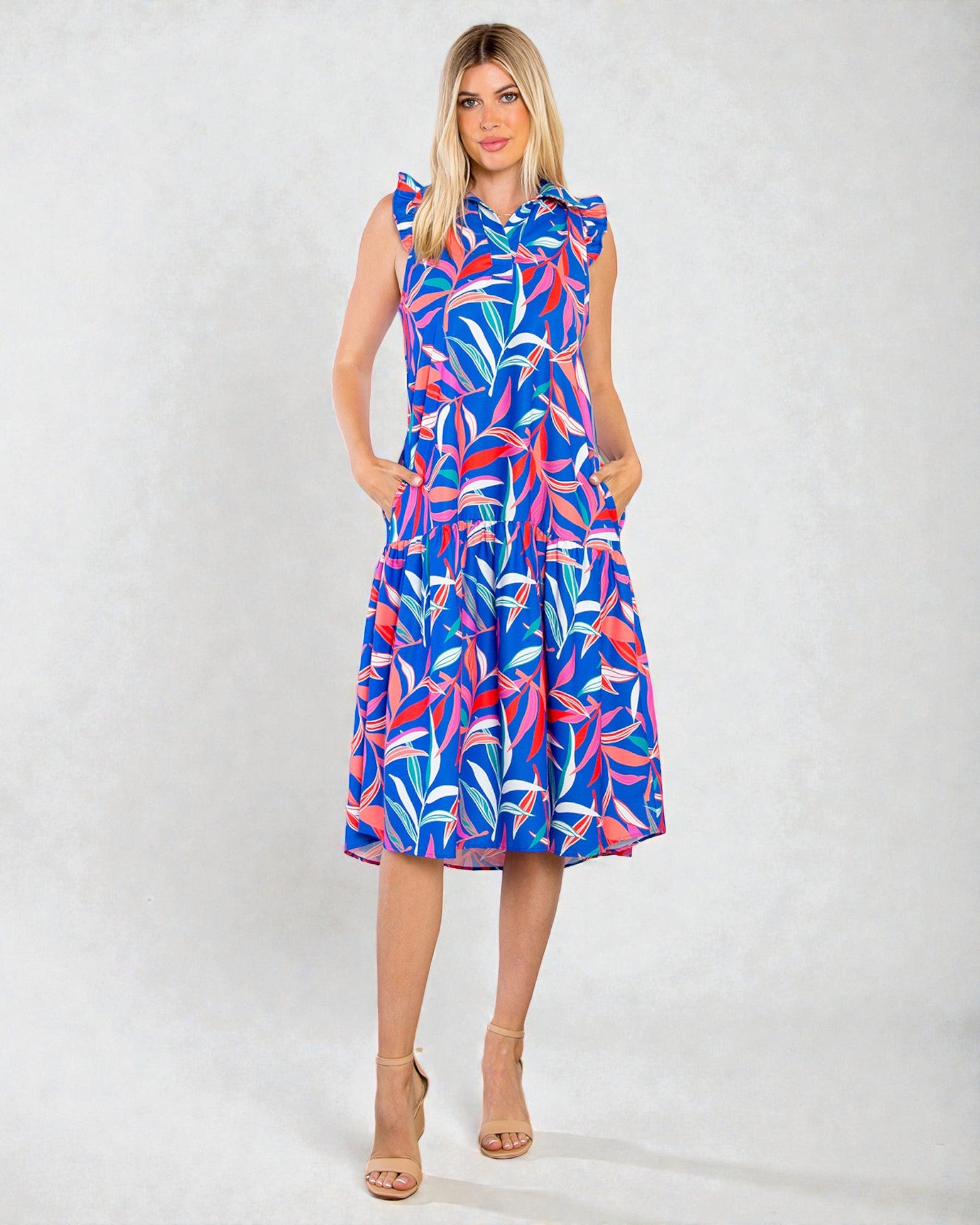 Woman wearing a colorful dress with a white background