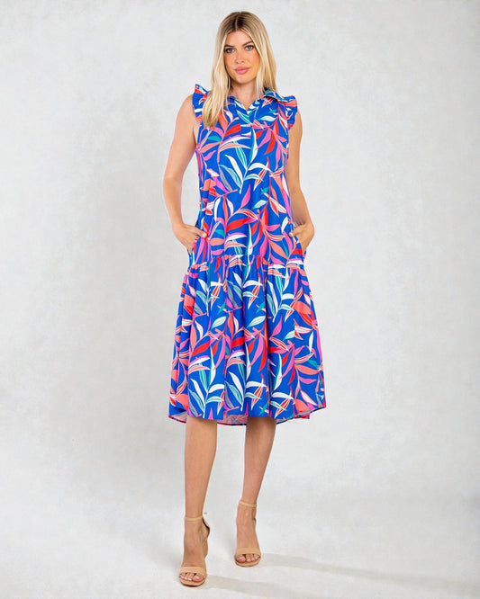 Woman wearing a colorful dress with a white background