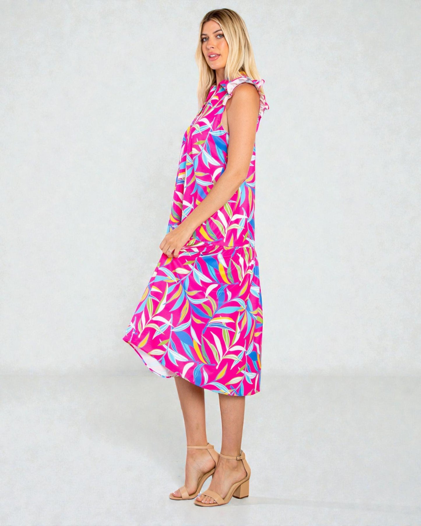 Woman wearing a colorful dress with a white background