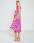 Woman wearing a colorful dress with a white background